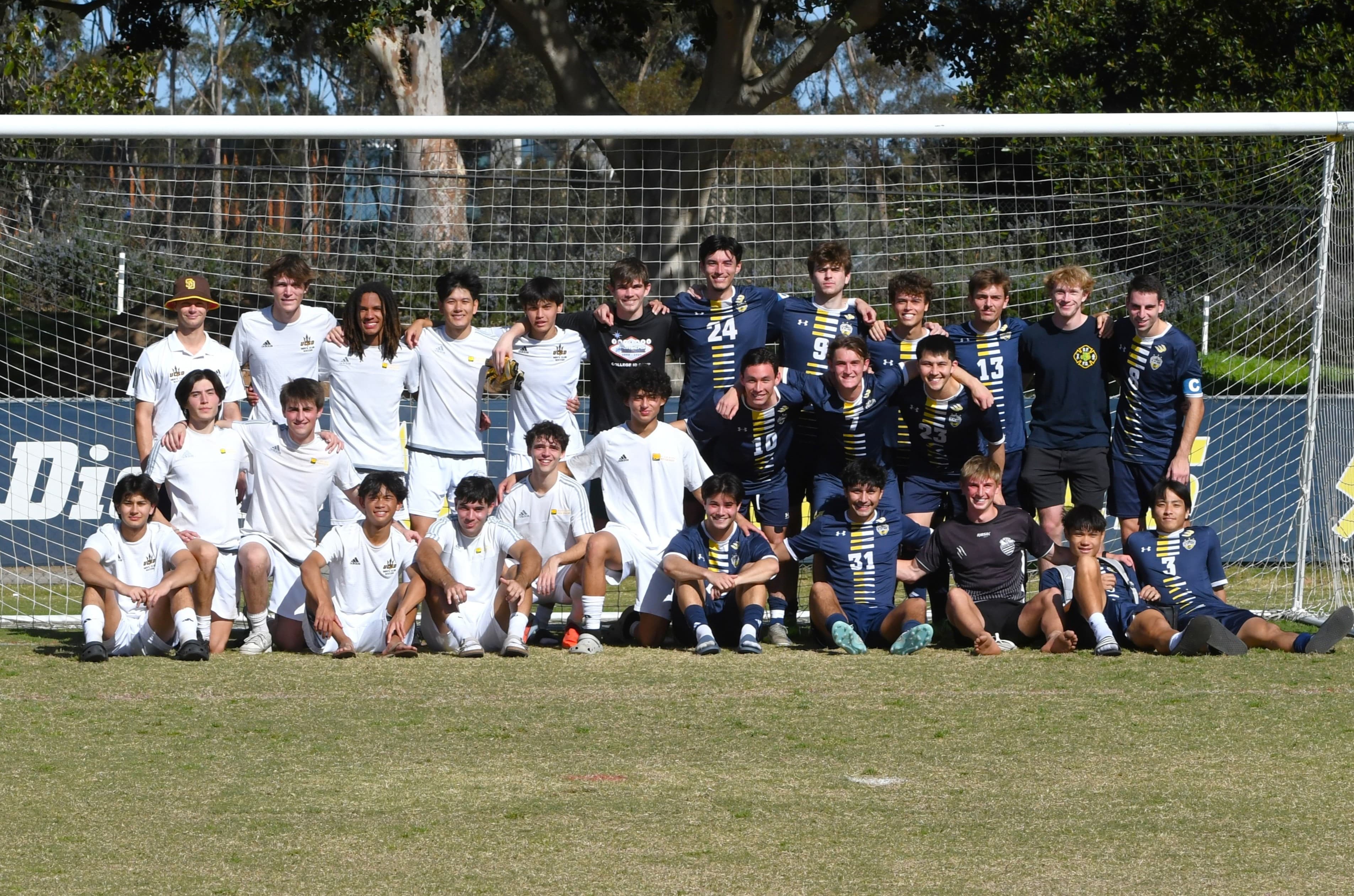 The UC San Diego men's club soccer squad, lined up in front of a goal.